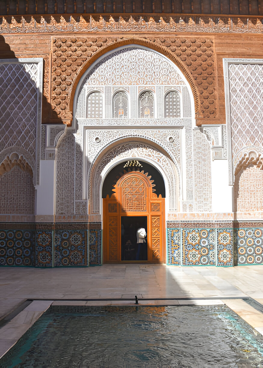 Zellige tilework and carved stucco in a historic Marrakech courtyard