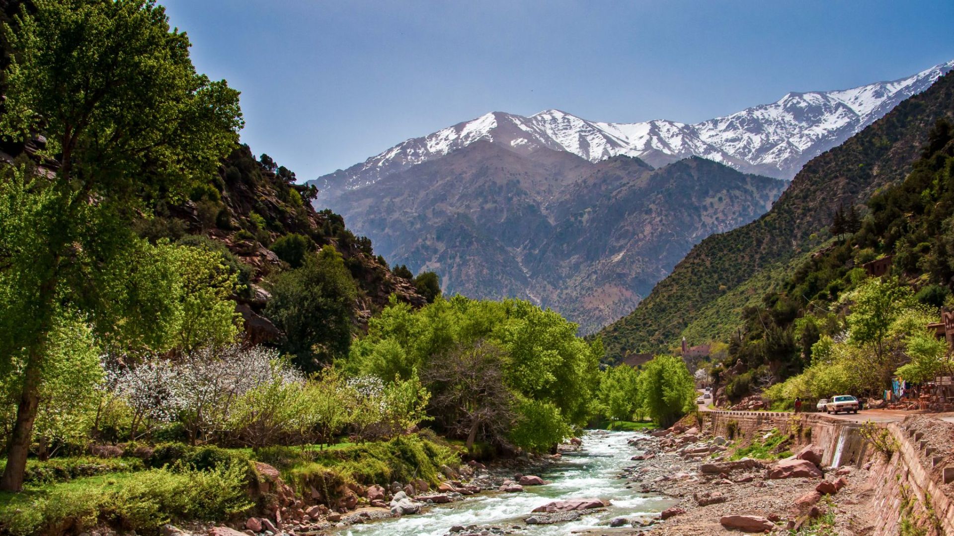 Snow-capped High Atlas peaks above the green Ourika Valley